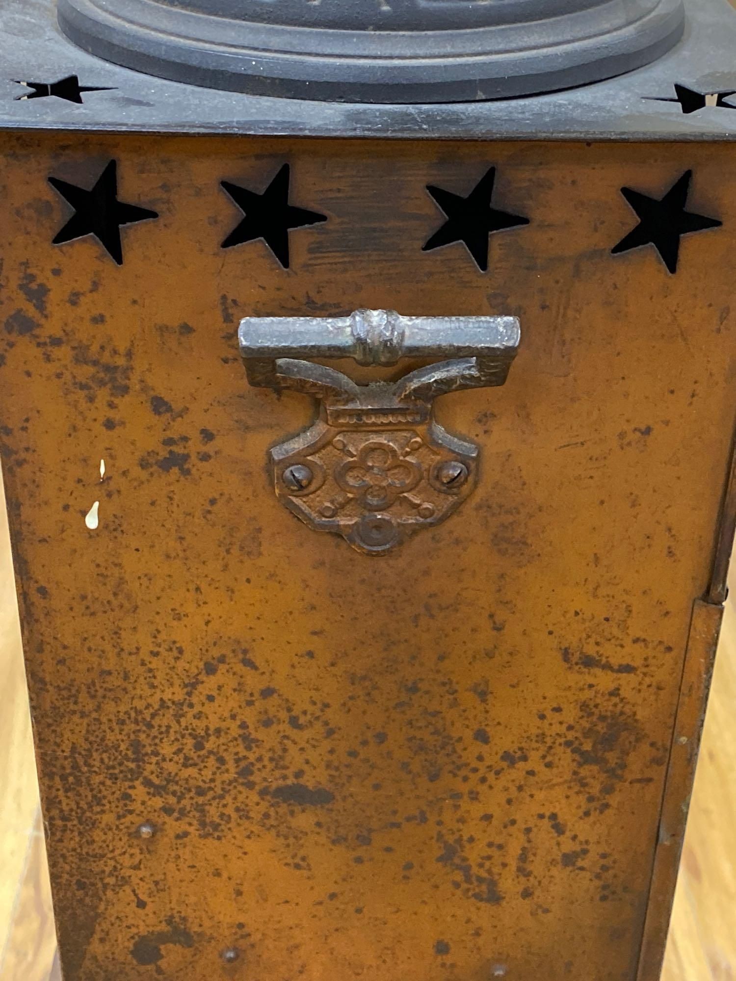 A Rippingilles Patent ABC Stove, Albion Lamp Co., oxidised copper frame, with leaded stained glass panel, circa 1860, 64cm high